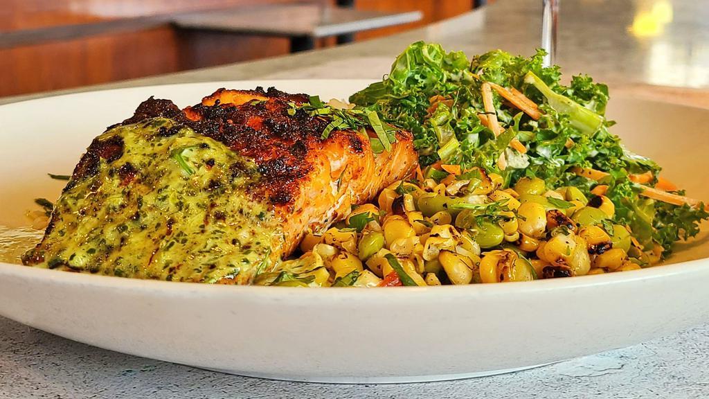 Grilled Cajun Salmon Bowl · Cajun seasoned salmon served over rice with mixed kale and a traditional corn salad. Served with our house made jalapeno-cilantro aoli.