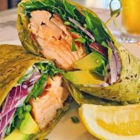 Grilled Salmon Wrap · Fresh grilled salmon with baby arugula, red onion, sliced avocado and diced tomato wrapped i...