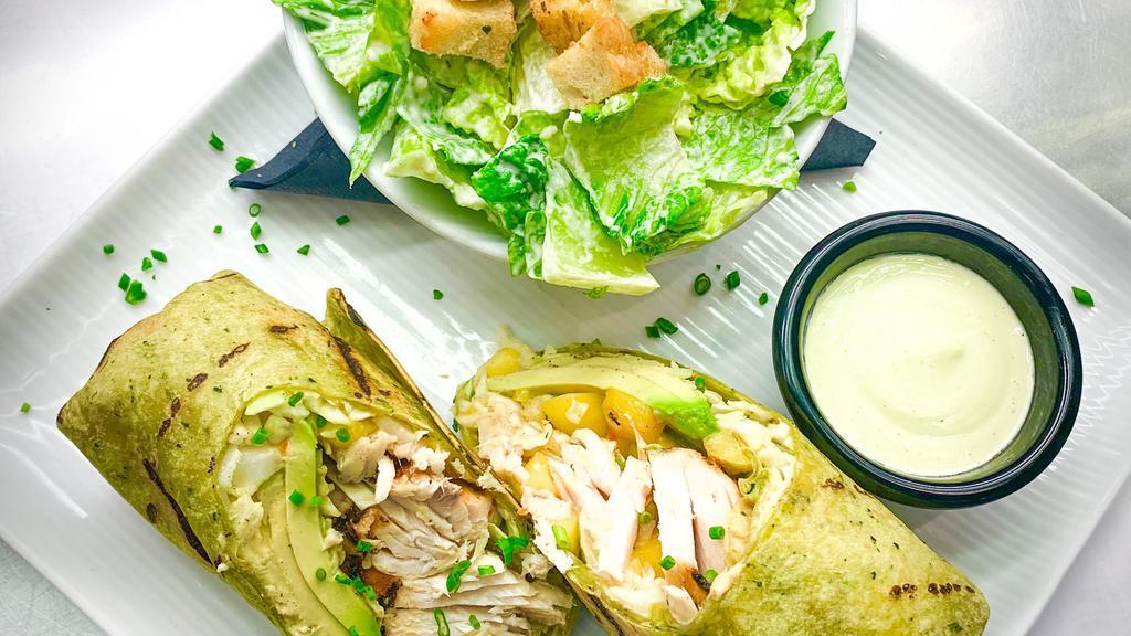 Grilled Mahi Wrap · Grilled mahi wrapped in a spinach tortilla with shredded cabbage, fresh mango salsa and sliced avocado. Served with our house-made aioli. Choice of mixed greens or caesar salad.