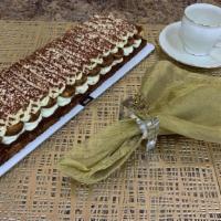 Tiramisù Traditional · Mascarpone cream on a sponge base covered by a row of espresso drenched ladyfingers, topped ...
