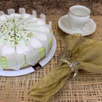 Pistachio Cheesecake · A creamy pistachio cheesecake with pistachio pieces, topped with a light pistachio mousse an...