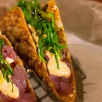Ahi Poke Tacos · marinated ahi, crispy won-ton, Sriracha aioli, seaweed salad