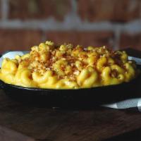 Truffle Mac · Elbow noodles with a rich mac and cheese sauce and truffle oil.