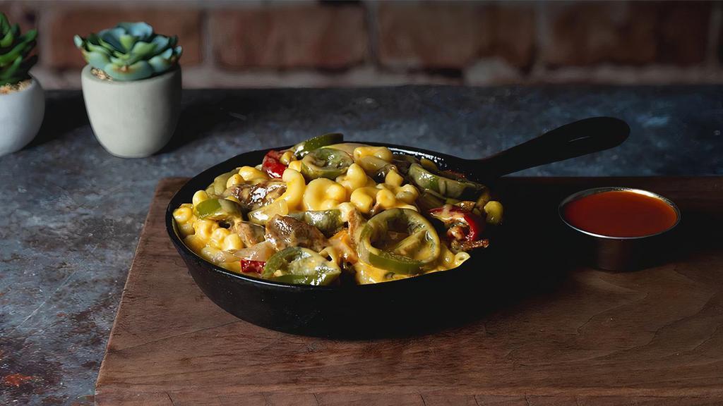 Tex Mex Mac · Rich Mac 'n' Cheese sauce, diced onions, bell peppers, jalapenos, and crushed red pepper.
