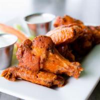 Wings · Served plain or coated with one of our sauces: spicy buffalo; BBQ sauce; pineapple cinnamon ...