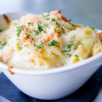 Lobster Mac 'N Cheese · Lobster, seafood mix, mozzarella, Parmesan, penne pasta our brandy cream sauce topped with b...