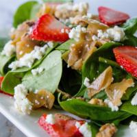 Spinach Salad (Full) · Fresh spinach, caramelized onions, candied walnuts, goat cheese, seasonal berries mixed with...