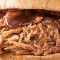 Bbq Smoked Pulled Pork · Special seasoned slowly roasted and smoked pork topped with our homemade BBQ sauce and coles...