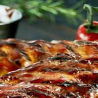 Baby Back Ribs Full Rack · Our Special Seasoned Smoked Baby back Ribs Slow 
cooked with BBQ sauce
