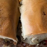 Smoked Tri-Tip Sandwich · Sliced Tri-Tip , caramelized onion,bell peppers , swiss cheese and bbq sauce