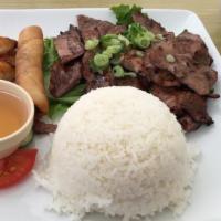 Com Thịt Heo Nướng, Tôm, Chả Gi · Grilled pork, grilled shrimp and egg rolls over steam rice.