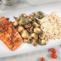 Cajun Salmon · Spiced blackened salmon served with sauteed Brussels sprouts and cilantro lime rice.