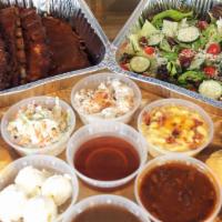 Family Ribs Meal · Four 1/2 Slabs of St.Louis Ribs, family style house salad w/balsamic vinaigrette, 4 individu...