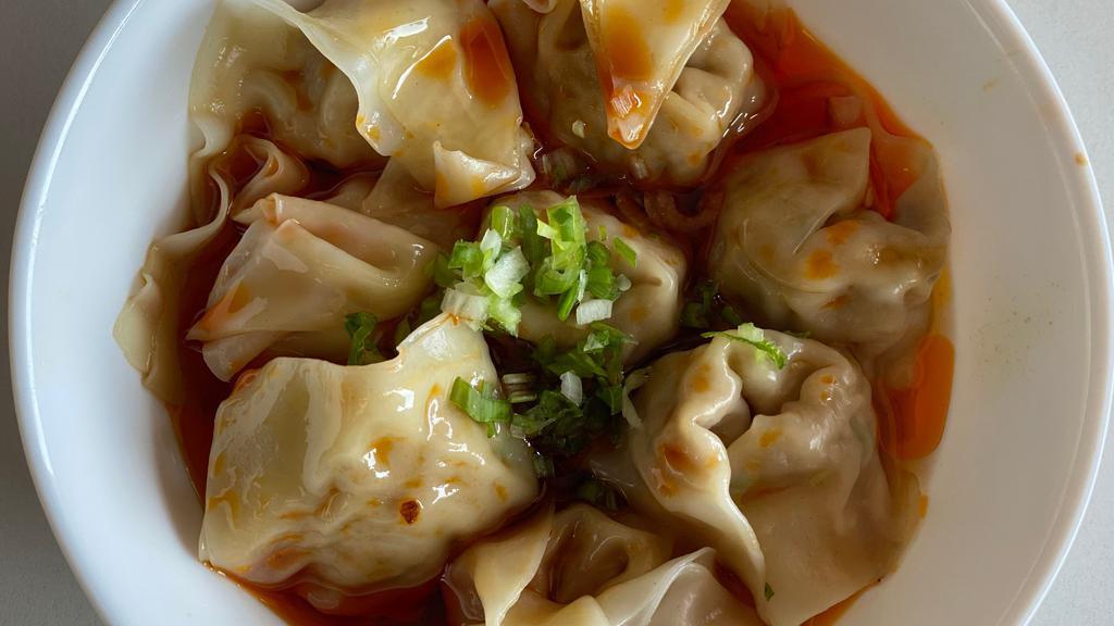 Shrimp & Pork Wontons In Chili Oil (8Pc) · NEW! wontons with shrimp and pork filling, served in our homemade chili oil, topped with scallions