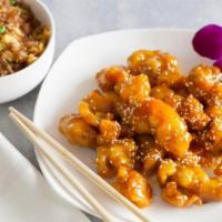 Honey Chicken · Fried chicken meat tossed in house made honey sauce topped sesame seeds. Served with a side ...
