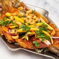 Crispy Trout Mango · Deep fried whole trout served with mange, chili, cilantro, and cashew nut.