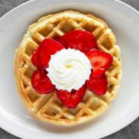 Fresh Strawberry Waffle · A crisp Belgian waffle topped with fresh strawberries and whipped cream. Served with syrup.