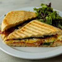 Breakfast Panini · Two eggs, bacon, arugula, tomato, swiss cheese, mayonnaise.