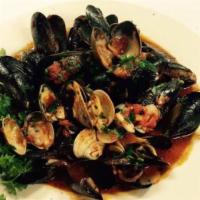 Clams & Mussels Posillipo · Clams and mussels steamed with garlic and tomato sauce.