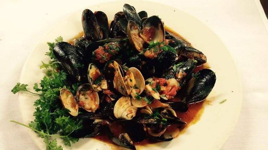 Clams & Mussels Posillipo · Clams and mussels steamed with garlic and tomato sauce.