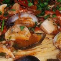 Linguini Alla Pescatore · Fresh manila clams, black mussels, sauteed calamari, and shrimp. Prepared in a garlic and ol...