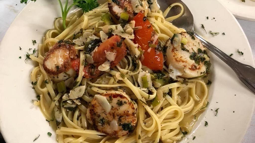 Linguini Scallops · Fresh scallops sauteed with white wine, butter, and garlic. Served over a bed of linguini pasta.