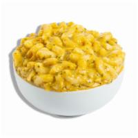 Snapback Famous Mac · Tender elbow pasta in a blend of rich cheeses kicked up with a shot of SnapBack seasoning in...