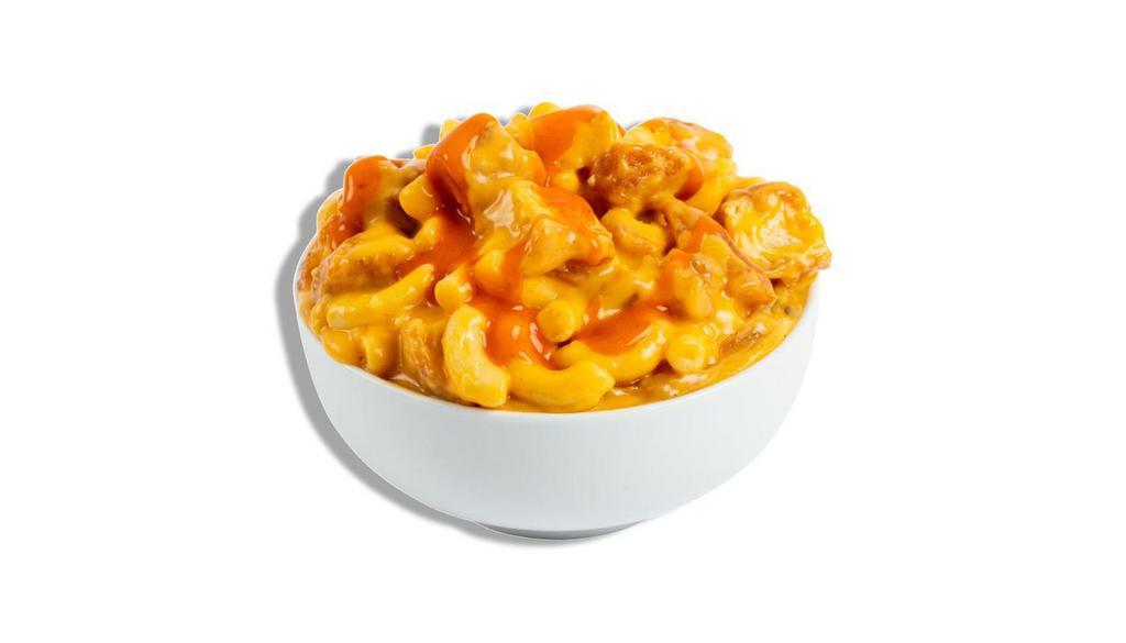 Buffalo Chicken Mac · Tender elbow pasta in a blend of rich cheeses turned up to eleven with our house made buffalo sauce and loaded with chunks of our famous all white meat tenders.