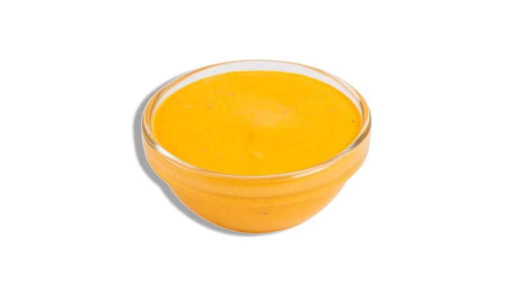 Cheddar Sauce · 2 oz. portion of our house made cheddar cheese sauce.