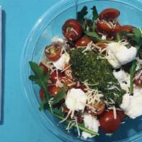 Caprese Salad · Cherry Tomatoes, Basil, Mozzarella, Balsamic, Olive Oil and Salt and Pepper.