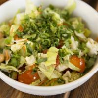Market Chopped Salad · Chopped lettuce and cabbage, cherry tomatoes, carrots, cucumbers, garbanzo beans, basil, red...