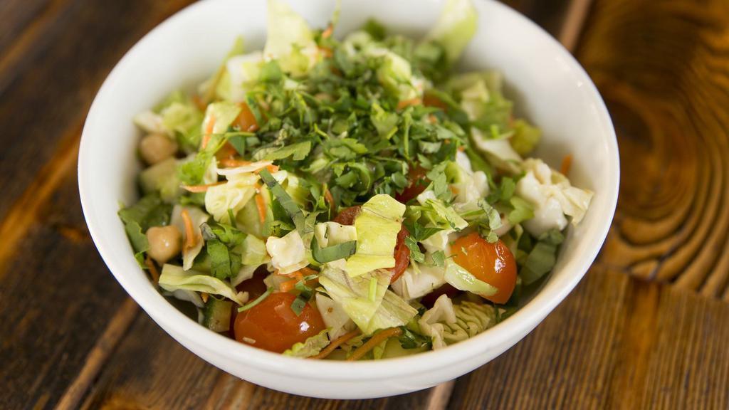 Market Chopped Salad · Chopped lettuce and cabbage, cherry tomatoes, carrots, cucumbers, garbanzo beans, basil, red wine vinaigrette.