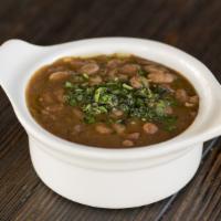 Ranch Beans · Pintos, toasted chiles, brisket bark.