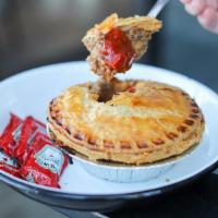 Aussie Meat Pie · Iconic grab-and-go pastry from Down Under, featuring vegemite and Worcestershire sautéed wit...