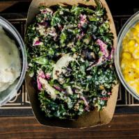 Kale Slaw · Kale, tahini, paper thin lemon slices, pumpkin seeds and quinoa. Vegan.