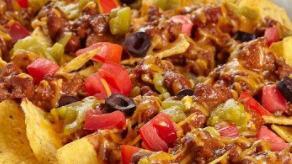 Loaded Nachos · Choose your choice of protein chicken or steak. Of course, tortilla chips, cheese, rice, bea...
