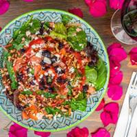 Rumi Salad · Mixed greens, dried cranberries, crushed walnuts, feta cheese, tomato and Rumi raspberry vin...