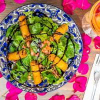 Yoga Salad · Mixed greens, tomato, veggie rolls (veggie/bean filling) and balsamic glaze.