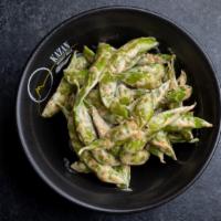 Spicy Edamame · Sautéed in shell edamame with fresh garlic cloves, chili paste and Miso