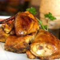 Thai Bbq Chicken · Half of a chicken marinated in a melody of Thai spices and then barbecued. Served with stick...
