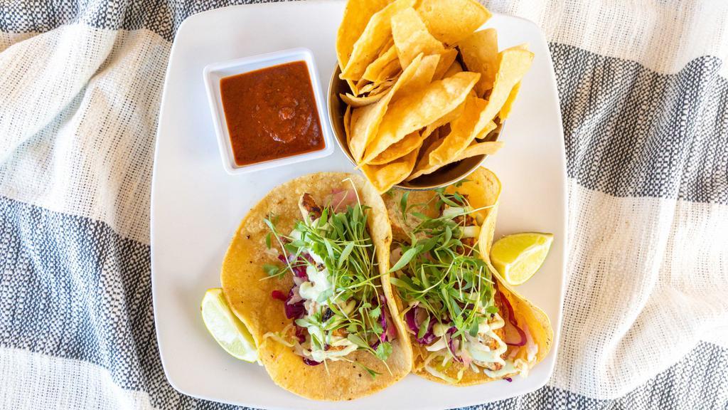 Fresh Tacos · Gluten free. Local catch or grilled shrimp corn tortillas cabbage lime crema radish chips & local hot licks' hot sauce.