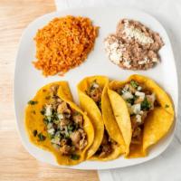 Taco Plate · Popular item. Three soft tacos served with rice and beans with your choice of meat. Carnitas...