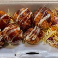 Cheesy Corn Croquette · Homemade mash potato balls filled with corn, spam and cheese drizzled with teriyaki and Japa...