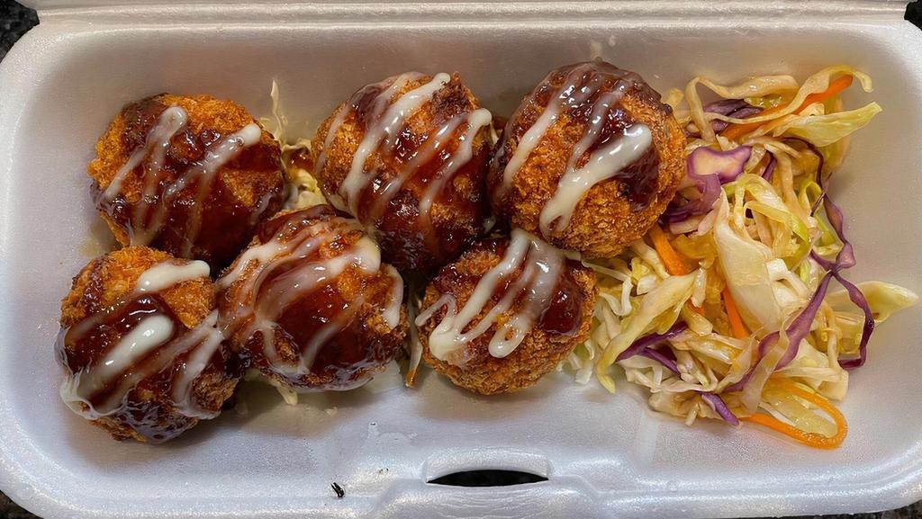 Cheesy Corn Croquette · Homemade mash potato balls filled with corn, spam and cheese drizzled with teriyaki and Japanese mayo