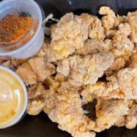 Chicken Karage · Gluten-free. Deep fried crispy dark meat chicken with oishi sauce & chili powder