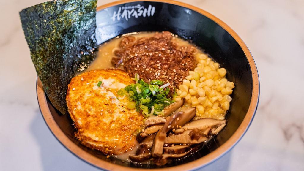 Shoyu Ramen · Grilled steak, pan fried egg, hand cut sweet corn, shitake mushroom, green onion, and nori (seaweed).(thick noodle)