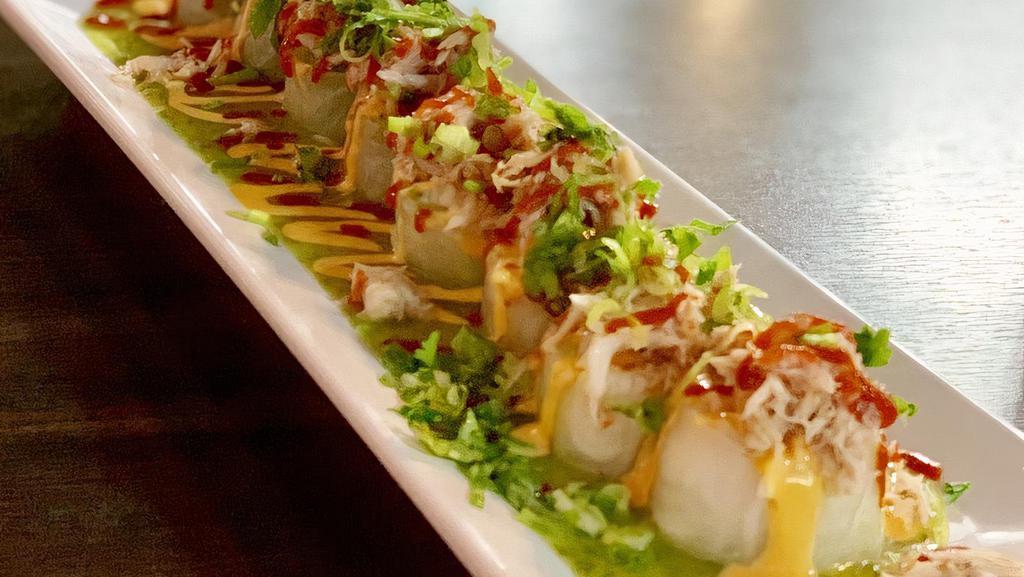 Spicy Crab Roll · Special. Spicy. Tempura shrimp, noodle, carrots, jalapeños lettuce and avocado, topped with cilantro avocado dressing, crab meat, Spicy mayo, sriracha, cilantro and green onions.