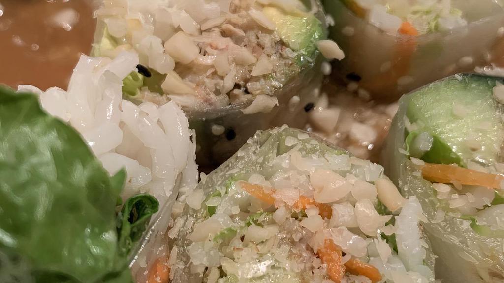 Cali Roll · Lettuce, carrot, crab, noodles, cucumber, avocado, covered with toasted sesame seeds, served with peanut sauce.