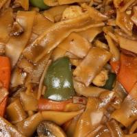 Drunken Noodles · Sautéed with basil, bell peppers, carrots  and mushrooms in house sauce over thick rice nood...