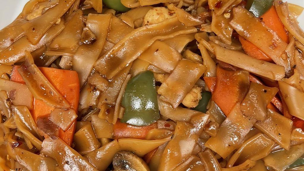 Drunken Noodles · Sautéed with basil, bell peppers, carrots  and mushrooms in house sauce over thick rice noodles.
*Seafood includes mussels, shrimps, and calamari.